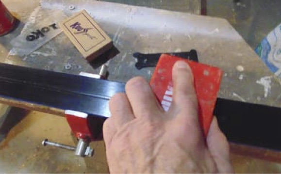 Brushing freshly waxed skate skis